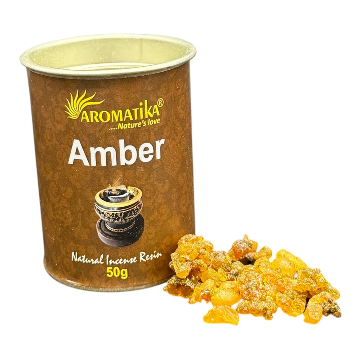 Hier sieht mann Räucherwerk aus Amber (Bernstein) in einer Dose mit weissem Hintergrund