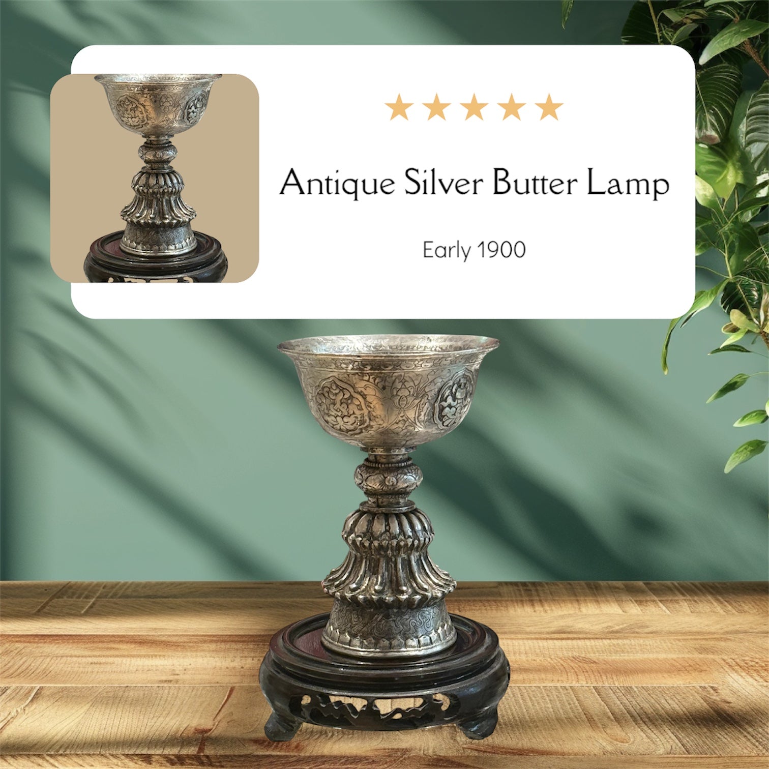 Eine antike Butterlampe aus Silber auf einem Tisch.  