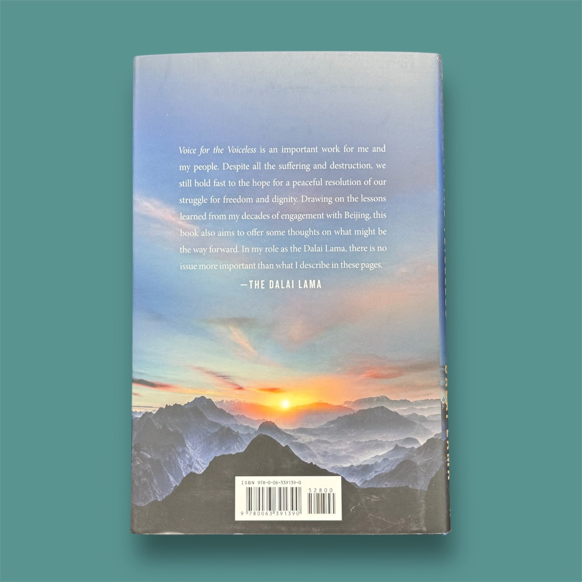 The photo shows a books called the Voice for the Voiceless with a green background.